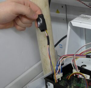 Alliance ID chip (MIX23B) on the short harness at the control. The chip stays with the machine.